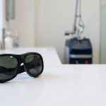 Laser safety goggles on a counter in a tattoo removal clinic