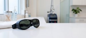 Laser safety goggles on a counter in a tattoo removal clinic