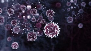Monochrome illustration of cancer cells against a black background
