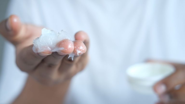 Petroleum jelly on fingers.