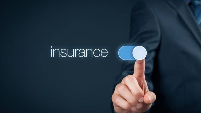 A person in a business suit pressing a toggle switch labeled "insurance."